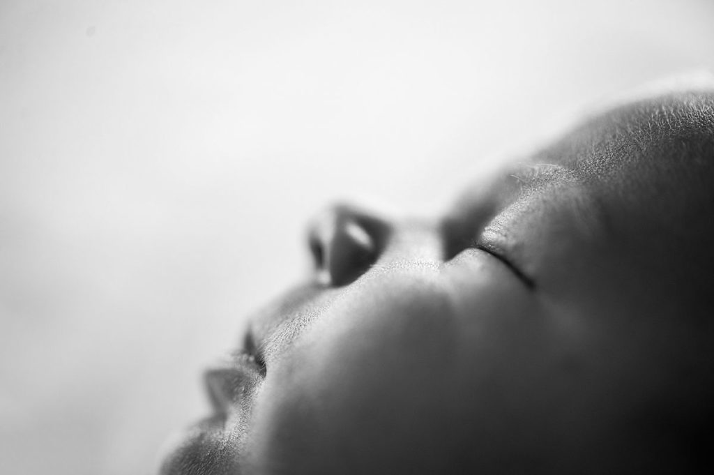 Newborn-Photography-Basingstoke-Winchester_0094 Face detail close up peaceful sleeping newborn baby portrait natural light photography Basingstoke studio