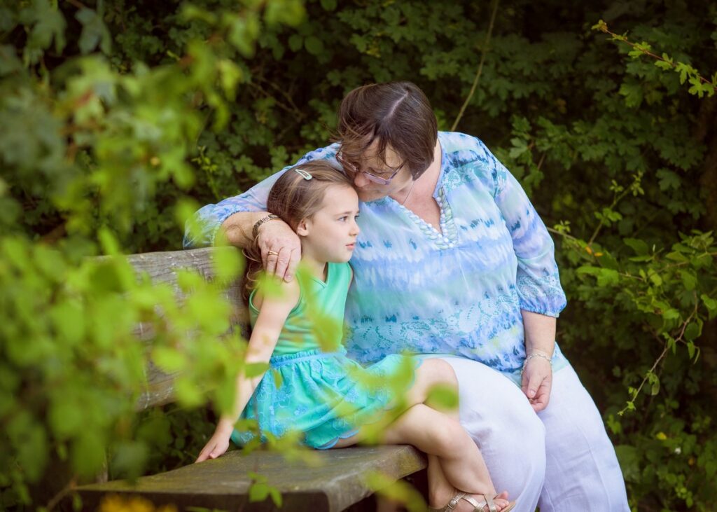 grandma kissing granddaughter