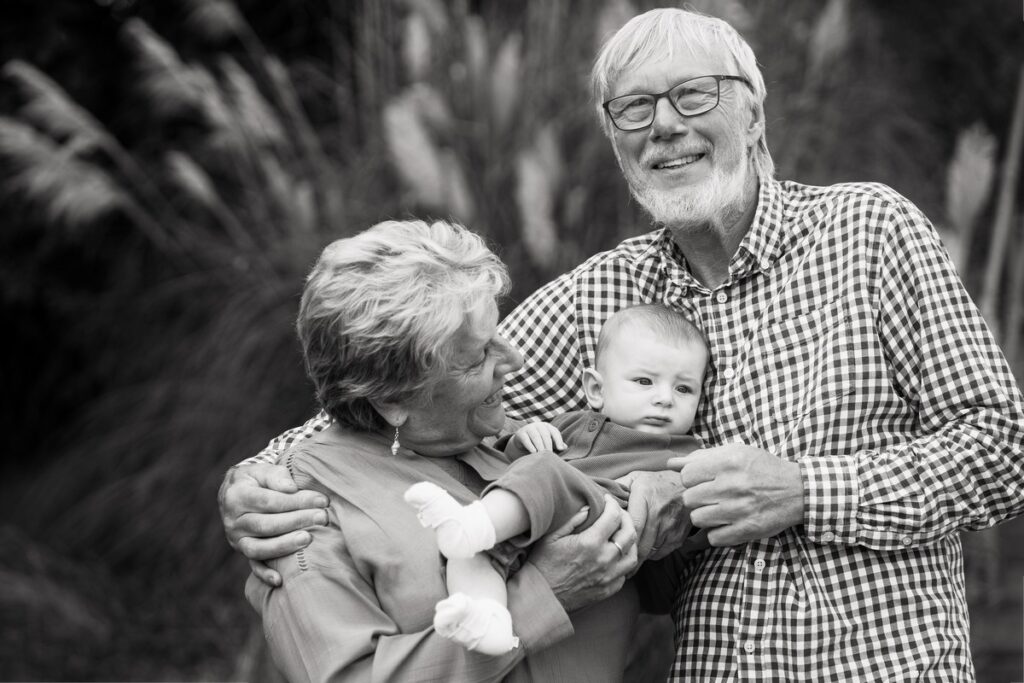 grandparents with baby portrait black and white