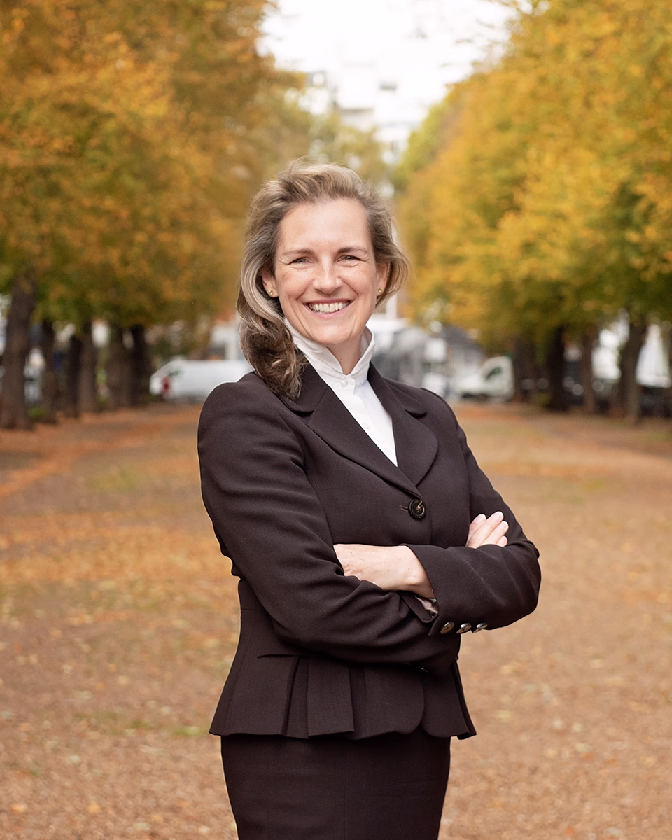 a lifestyle portrait of a property professional in an outdoor urban location