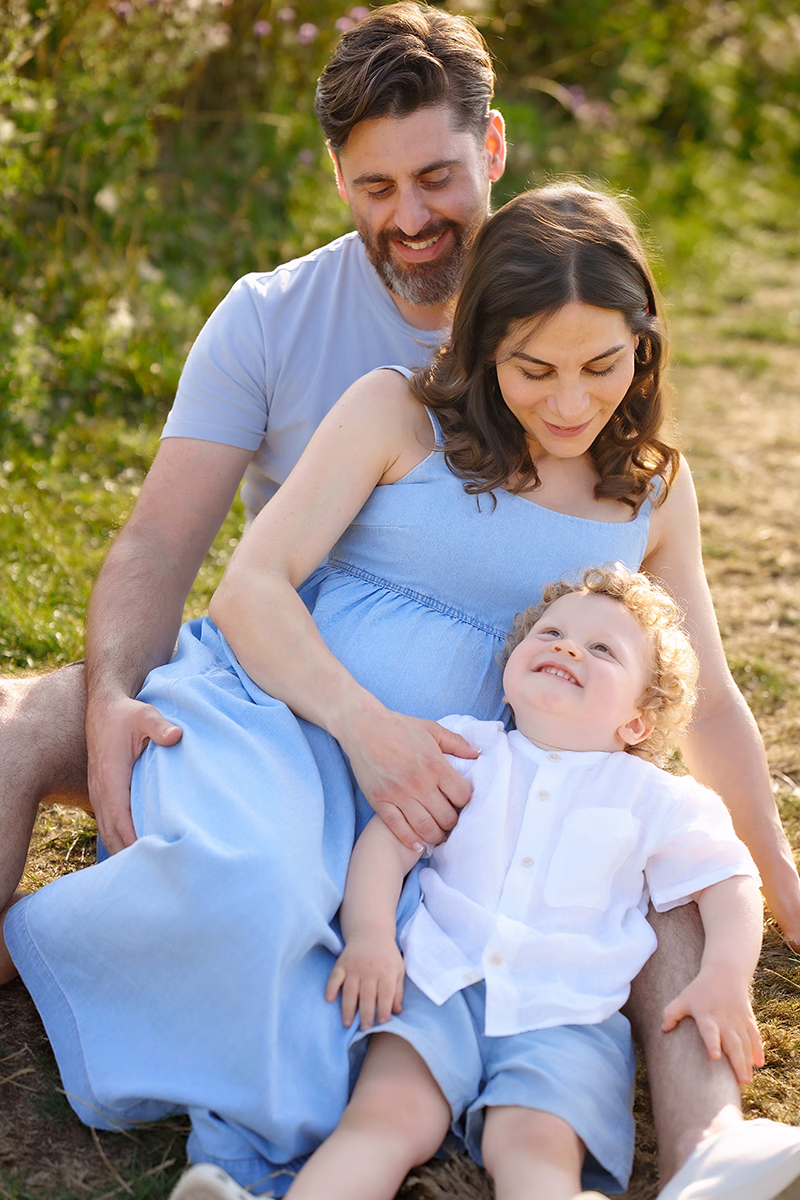 maternity-photography-sibling3 informal family portrait with pregnant mum, dad and toddler in a picturesque outdoor location in London