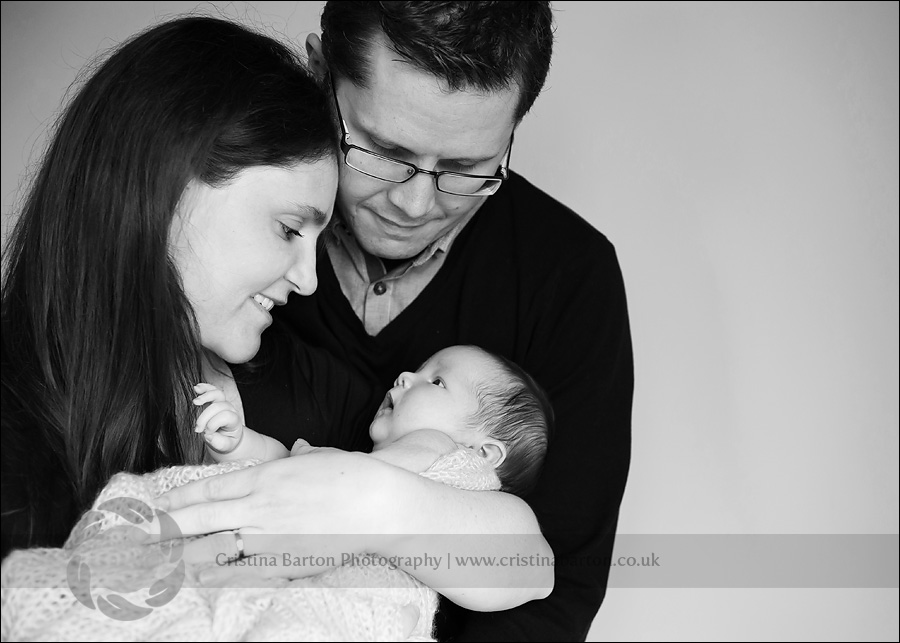 Family with their beautiful newborn baby in Surrey